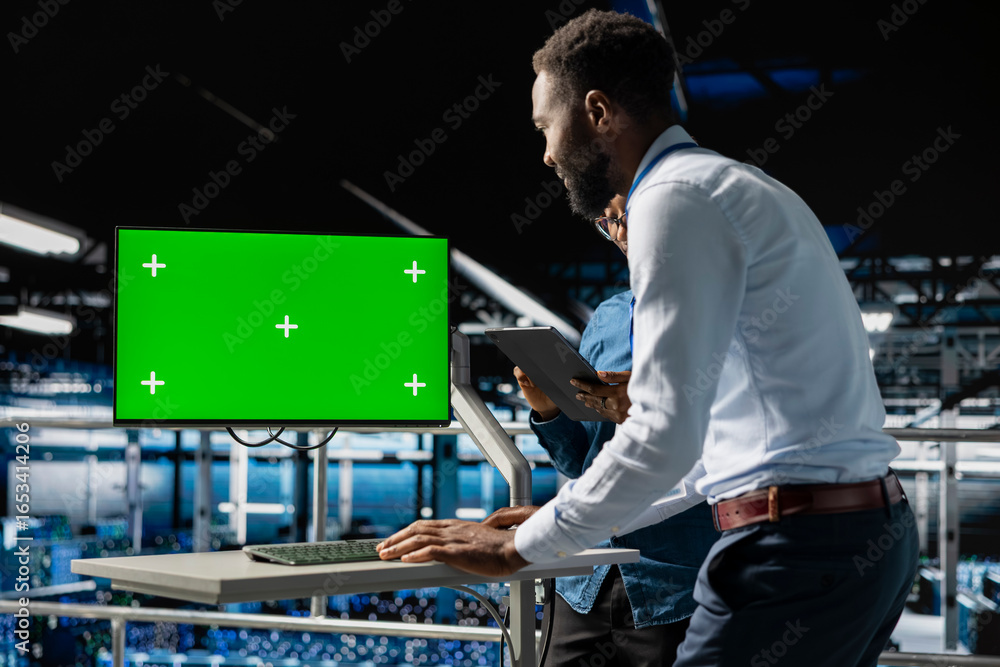 Poster african american it experts using chroma key device to analyze neural network systems. data center a
