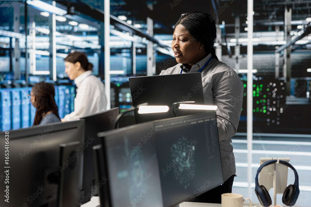 Poster software developer overseeing server clusters doing data intensive operations. it expert using lapto