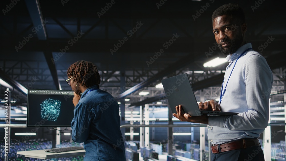 Poster smiling data center engineering team on industrial platform collaborating on neural network software