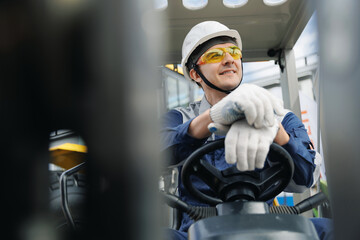 Industrial driver of forklift, Male worker operating machinery in mining industry with protective gear