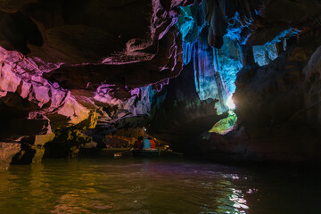 Colorful limestone cave exploration by boat in Ninh Binh, Vietnam
