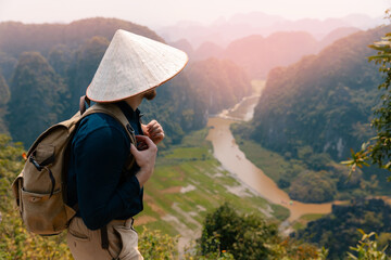 Male traveler enjoying scenic mountain view in Ninh Binh, Vietnam