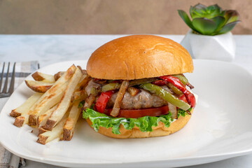 sausage burger  top with peppers and onions