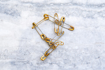Fototapeta premium Group of Safety Pins Lying in a Pile 