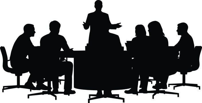 Silhouettes of Figures Seated Around a Conference Table in Discussion