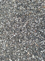 Fine Grey Gravel Texture: Ideal background for construction, landscaping, or minimalist design. Durable, natural stone for paths, gardens, and drainage. Build your foundation.
