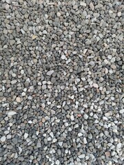 Fine Grey Gravel Texture: Ideal background for construction, landscaping, or minimalist design. Durable, natural stone for paths, gardens, and drainage. Build your foundation.