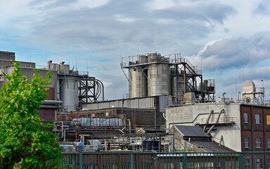 Large industrial plant with metal towers, pipes, and stair structures in Hamburg