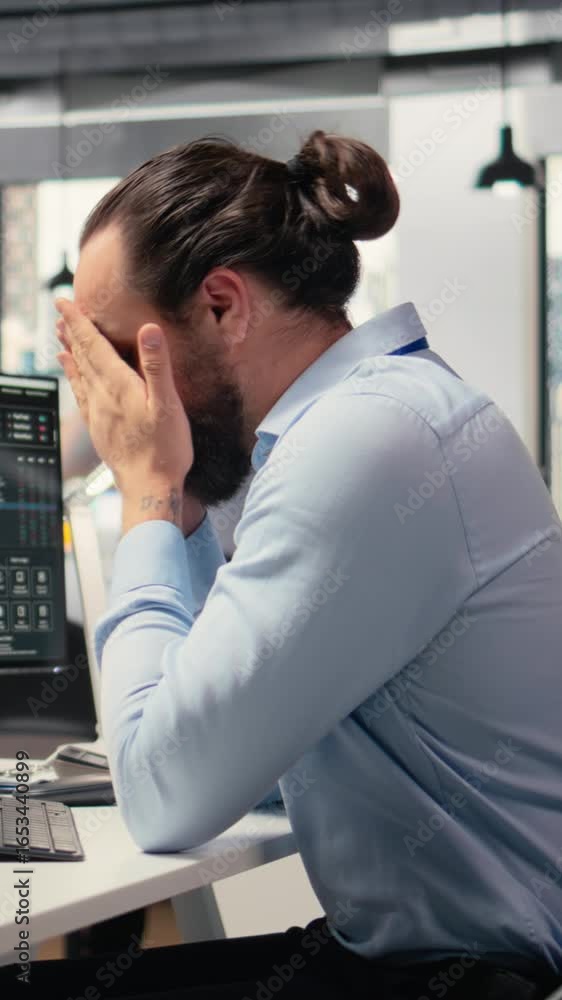 Poster vertical video trader covering face in disbelief, concerned by investment portfolio value drop after