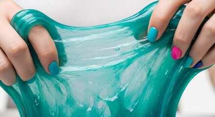 Woman stretching green slime with hands. Playful squishy toy for stress relief and creative activity for children. Hobby concept.