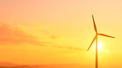 Wind turbine silhouetted against a vibrant sunset sky