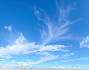 Serene Blue Sky with Wispy Cirrus Clouds:  Peaceful, Dreamy, and Tranquil Summer Atmosphere.
