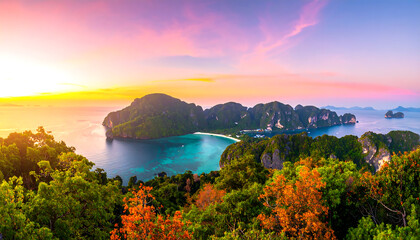 Serene tropical island panorama: vibrant sunset, turquoise bay, lush foliage, dramatic cliffs, idyllic beach, breathtaking vista.