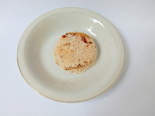 Nasi liwet. Indonesia traditional cullenarry. Served on white plate. 