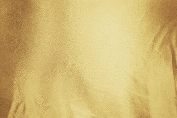 Gold golden orange yellow champagne white abstract background. Shiny silk fabric. Metallic shine....