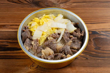 angle view portable clay pot rice with beef at horizontal composition
