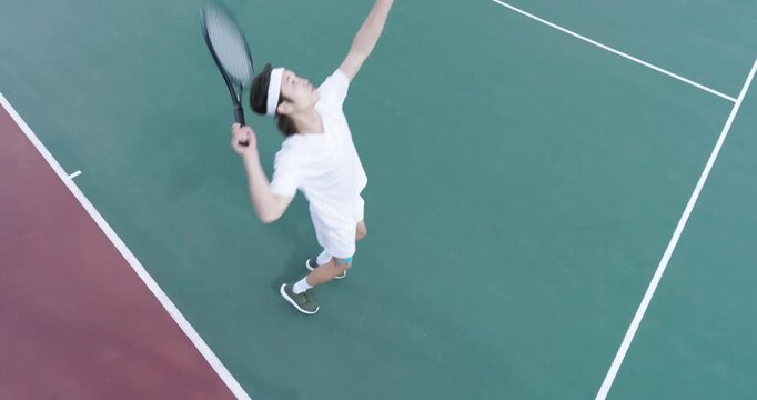 Ball toss sparking Diverse male teammates serving shot and volleying starting rally on court