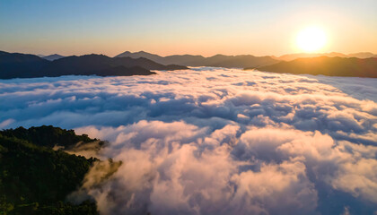 Serene Sunrise: Aerial View of Mountains Above a Sea of Clouds, Golden Hour Light, Peaceful Atmosphere, Dramatic Landscape Photography.
