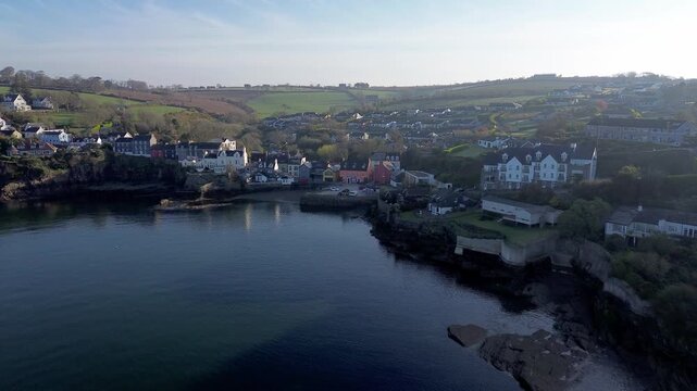 Drone Dolly Forward Towards Traditional Irish Harbor in Kinsale at Sunset