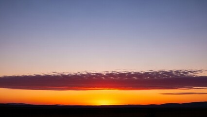 Fototapeta premium Take a photo of the sky gradient with a wide-angle lens at the “golden hour” to create an emotional atmosphere. 