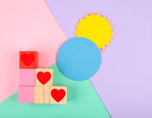 Colorful wooden blocks with hearts and a sun