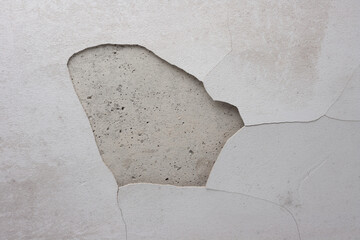 Hole in wall. Cracks and mold on plaster