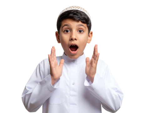 Young boy in traditional attire expressing surprise or excitement with open mouth and raised hands