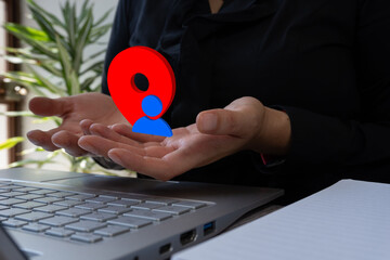 user location. Business person holding a small 3D icon of a location pin with an avatar of