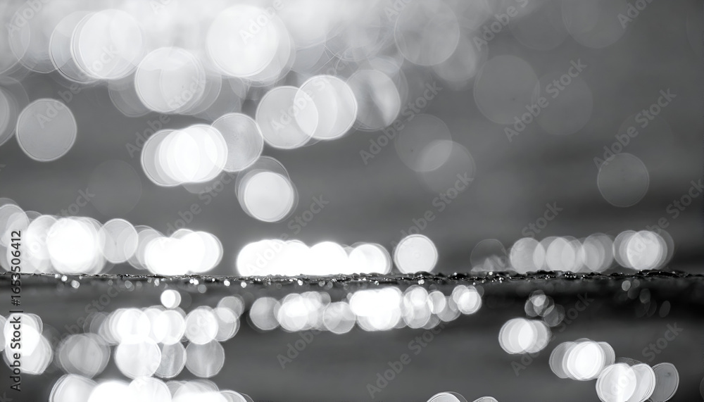 Poster abstract black and white water surface with sparkling light reflections and beautiful bokeh circles,