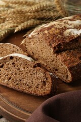 Pieces of fresh rye bread on table, closeup