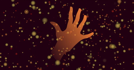 Image of orange spots and hand on black background