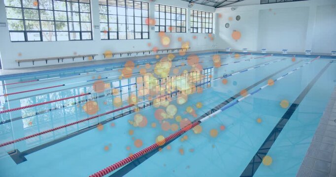 Glowing orbs emerging above lap pool then coalescing and drifting outward filling entire frame