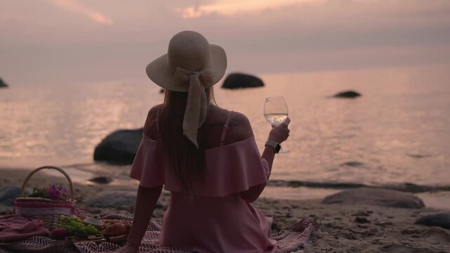 young woman in straw hat sit on plaid have picnic