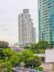 Obraz premium 17 August 2025 BKK high rise towers building residential apartments and commercial buildings on Chao Phraya River Bangkok Thailand