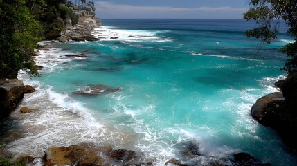 Fototapeta premium A breathtaking coastal scene showcasing turquoise water crashing against rocky shores.