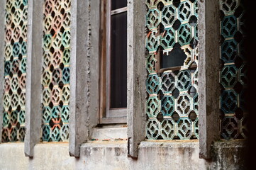 Architectural detail of Tunghai University campus building featuring ornate perforated wall design...