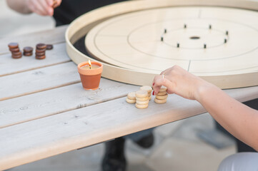 Strategic Game Pieces on a Wooden Board crokinole. 