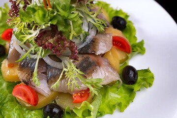 Salted mackerel with boiled potatoes and vegetables