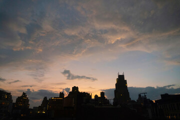 Fototapeta premium beautiful sunset over the buildings of a city