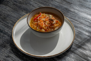 A bowl of shchi soup in a cafe. 
