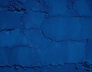 Obraz premium A weathered blue wall featuring prominent cracks and patches of dirt, showcasing a rustic charm and the passage of time in its textured surface.