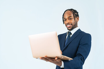 Black male business person using a laptop