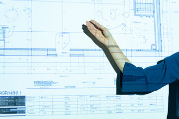 A woman giving a presentation using a projector
