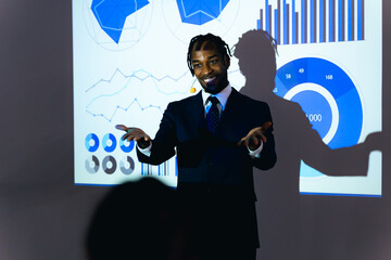 Black man giving a presentation using a projector