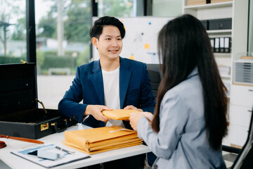 justice and law concept.passing bribe money in the envelop at lawyer office.