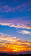 Fototapeta premium A sleek airplane soars gracefully through a bright blue sky, surrounded by fluffy white clouds, capturing the essence of freedom and adventure.