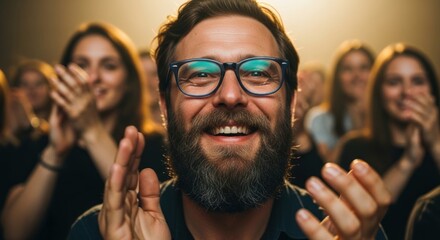 Enthusiastic crowd expressing appreciation at a performance with joyful man front