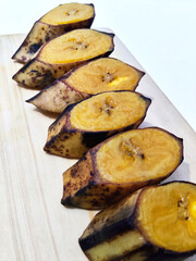 Close-Up View of Sliced Boiled Plantain on Wood