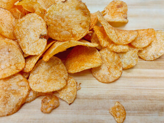Savory and Crunchy Potato Chips on a Natural Wood
