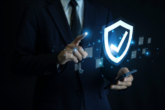 Businessman using AI technology for cybersecurity protection ensuring secure data access and privacy compliance with advanced digital risk management solutions